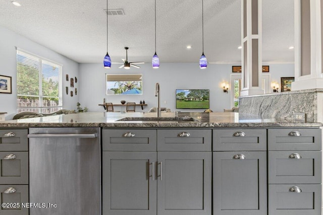 508 Lighthouse Ct, Neptune Beach, FL 32266 - kitchen featuring dishwasher, gray cabinetry, ceiling fan, light stone counters, and a textured ceiling