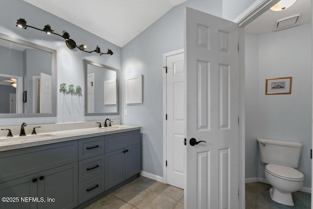 508 Lighthouse Ct, Neptune Beach, FL 32266 - full bathroom featuring double vanity, tile patterned floors, and vaulted ceiling