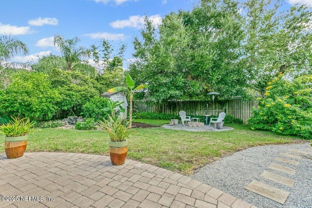 508 Lighthouse Ct, Neptune Beach, FL 32266 - fenced backyard featuring a patio area and an outdoor fire pit