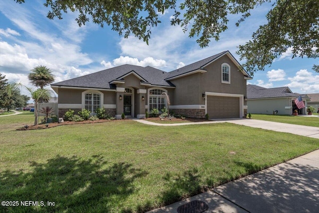 2484 Royal Pointe Dr, Green Cove Springs, FL 32043 - view of front of house featuring stone siding, an attached garage, stucco siding, driveway, and a front lawn