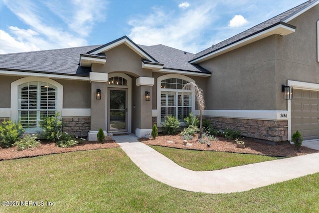2484 Royal Pointe Dr, Green Cove Springs, FL 32043 - entrance to property with stone siding, a shingled roof, a lawn, stucco siding, and an attached garage