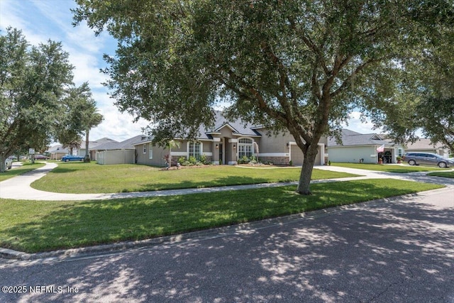 2484 Royal Pointe Dr, Green Cove Springs, FL 32043 - view of front of house featuring concrete driveway, a front lawn, stucco siding, and an attached garage