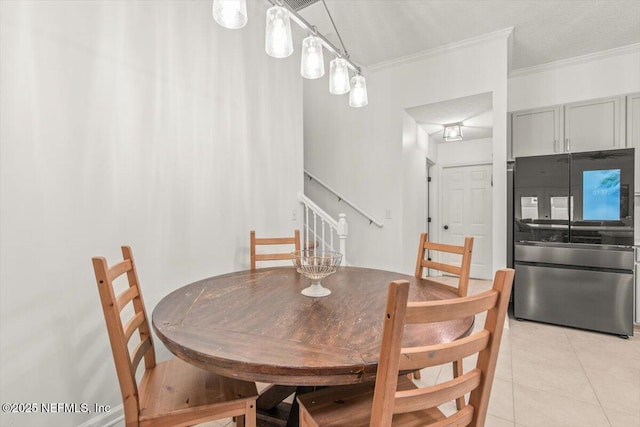 2484 Royal Pointe Dr, Green Cove Springs, FL 32043 - dining space featuring ornamental molding, light tile patterned flooring, and stairs