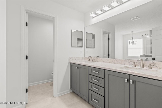 2484 Royal Pointe Dr, Green Cove Springs, FL 32043 - full bathroom with double vanity, a chandelier, and tile patterned floors