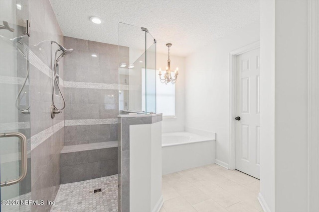 2484 Royal Pointe Dr, Green Cove Springs, FL 32043 - full bath with a stall shower, a bath, a chandelier, tile patterned flooring, and a textured ceiling