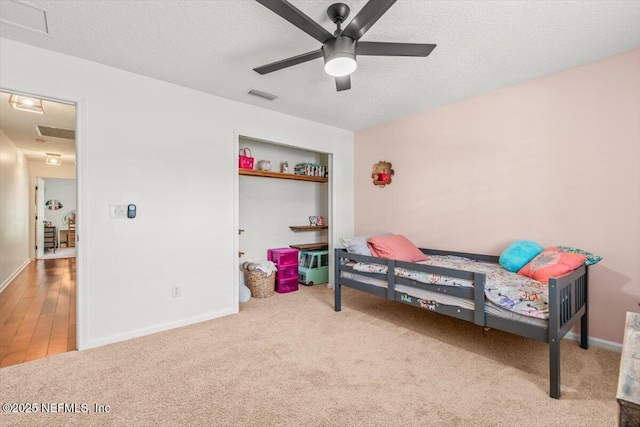 2484 Royal Pointe Dr, Green Cove Springs, FL 32043 - bedroom featuring carpet flooring, a textured ceiling, and ceiling fan
