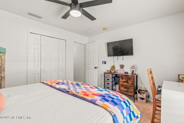 2484 Royal Pointe Dr, Green Cove Springs, FL 32043 - bedroom with carpet floors, a closet, and a ceiling fan
