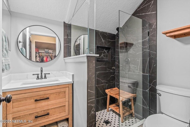 2484 Royal Pointe Dr, Green Cove Springs, FL 32043 - bathroom featuring a textured ceiling, vanity, and a marble finish shower