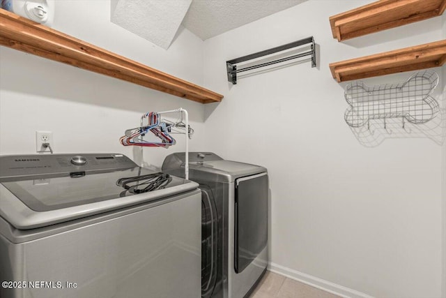 2484 Royal Pointe Dr, Green Cove Springs, FL 32043 - laundry area featuring washer and dryer and light tile patterned flooring