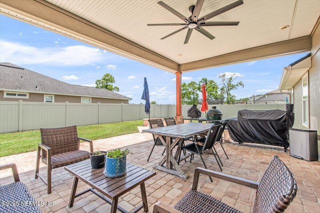2484 Royal Pointe Dr, Green Cove Springs, FL 32043 - fenced backyard with a patio area, a ceiling fan, and outdoor dining area