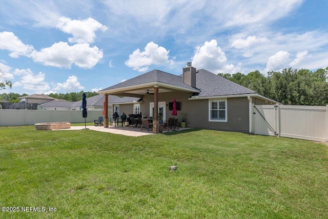 2484 Royal Pointe Dr, Green Cove Springs, FL 32043 - back of house featuring a fenced backyard, a patio area, a chimney, ceiling fan, and a gate