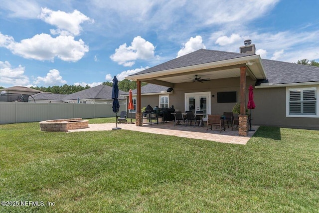 2484 Royal Pointe Dr, Green Cove Springs, FL 32043 - back of property with a fenced backyard, ceiling fan, french doors, roof with shingles, and stucco siding