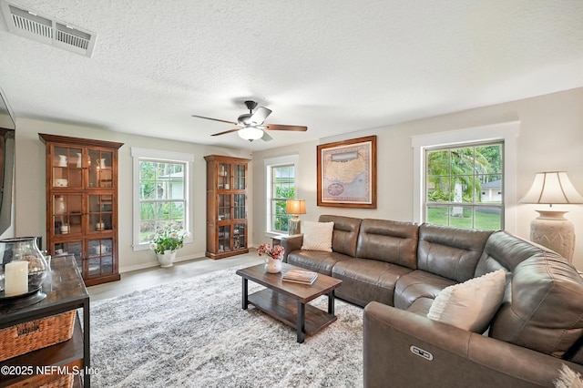 603 Miramar Ct, Ponte Vedra Beach, FL 32082 - living room featuring ceiling fan and a textured ceiling