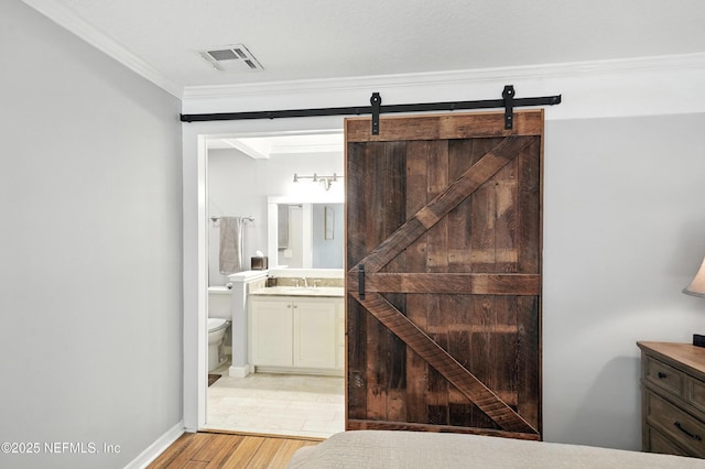 603 Miramar Ct, Ponte Vedra Beach, FL 32082 - bathroom featuring vanity, ornamental molding, and wood finished floors