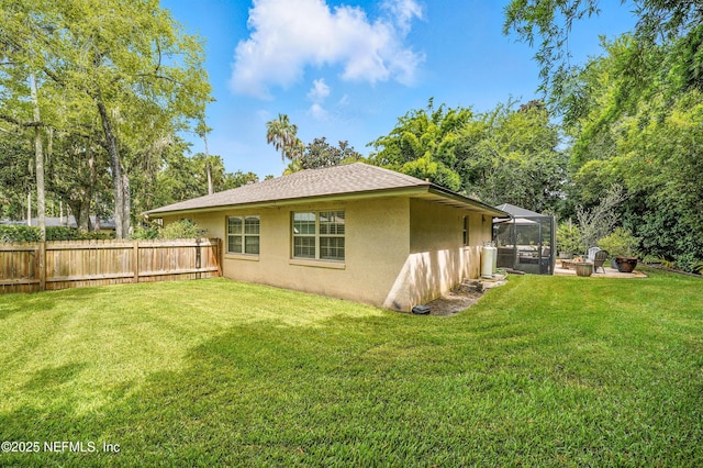 603 Miramar Ct, Ponte Vedra Beach, FL 32082 - rear view of house featuring stucco siding, glass enclosure, and a shingled roof