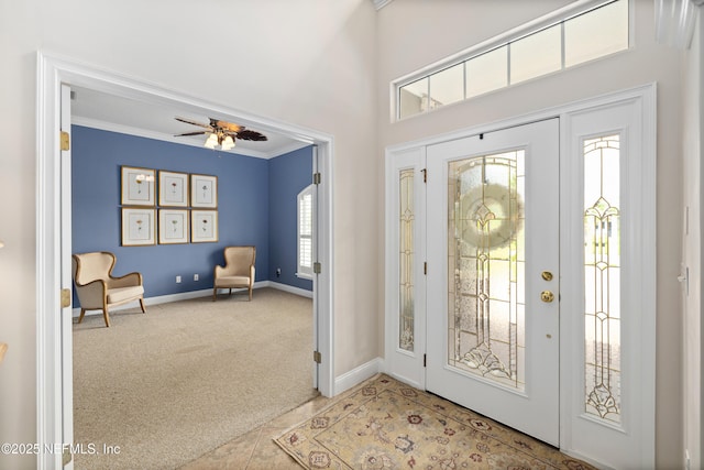 2269 Cascadia Ct, Saint Augustine, FL 32092 - entrance foyer featuring crown molding, carpet floors, ceiling fan, and a towering ceiling