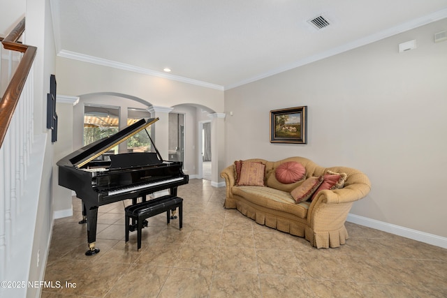 2269 Cascadia Ct, Saint Augustine, FL 32092 - living area featuring ornate columns, arched walkways, ornamental molding, stairs, and recessed lighting
