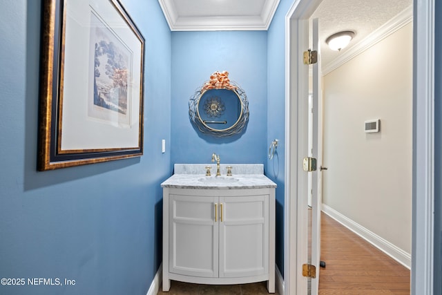 2269 Cascadia Ct, Saint Augustine, FL 32092 - bathroom featuring ornamental molding, vanity, and wood finished floors