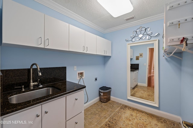 2269 Cascadia Ct, Saint Augustine, FL 32092 - washroom featuring cabinet space, washer hookup, electric dryer hookup, a textured ceiling, and ornamental molding