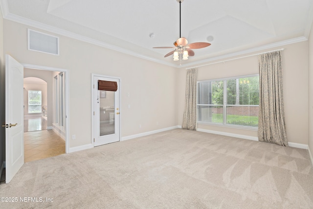 2269 Cascadia Ct, Saint Augustine, FL 32092 - tiled spare room with carpet flooring, ornamental molding, a ceiling fan, and arched walkways