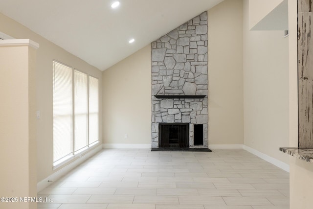 8305 Coralberry Ln, Jacksonville, FL 32244 - unfurnished living room featuring healthy amount of natural light, a stone fireplace, recessed lighting, and high vaulted ceiling