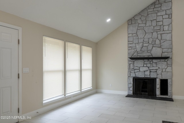 8305 Coralberry Ln, Jacksonville, FL 32244 - unfurnished living room featuring lofted ceiling and a stone fireplace