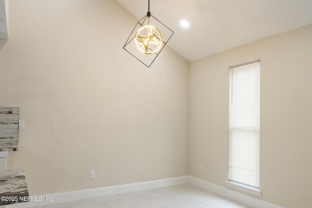 8305 Coralberry Ln, Jacksonville, FL 32244 - spare room with vaulted ceiling and plenty of natural light
