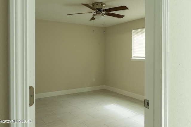 8305 Coralberry Ln, Jacksonville, FL 32244 - empty room featuring ceiling fan and baseboards