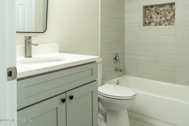 8305 Coralberry Ln, Jacksonville, FL 32244 - bathroom featuring vanity and shower / washtub combination