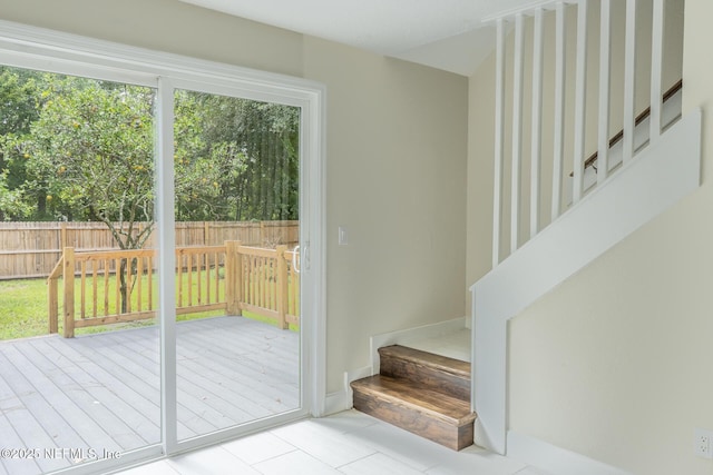 8305 Coralberry Ln, Jacksonville, FL 32244 - doorway to outside with stairway and tile patterned floors
