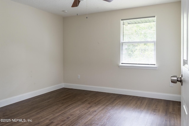 8305 Coralberry Ln, Jacksonville, FL 32244 - spare room featuring ceiling fan and dark wood-type flooring