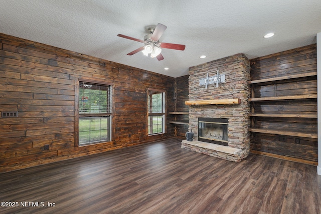 2871 Anchor Rd, Middleburg, FL 32068 - unfurnished living room with a textured ceiling, a fireplace, ceiling fan, wood finished floors, and recessed lighting