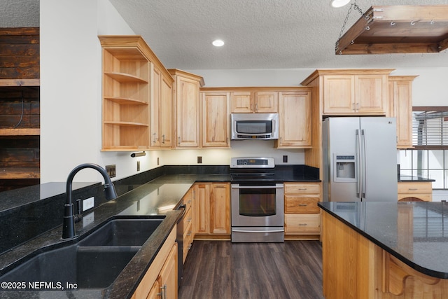 2871 Anchor Rd, Middleburg, FL 32068 - kitchen with stainless steel appliances, light brown cabinetry, dark wood-type flooring, a textured ceiling, and recessed lighting