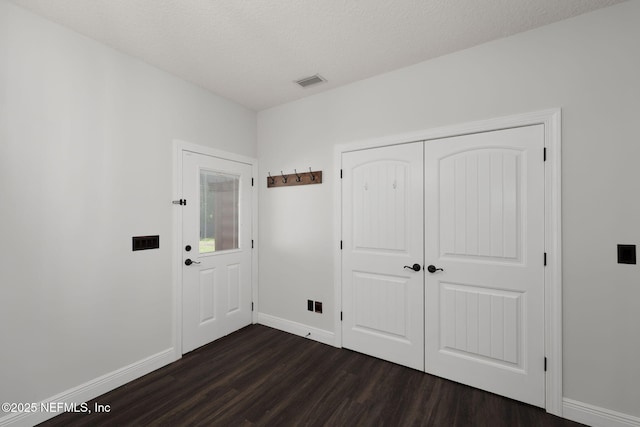 2871 Anchor Rd, Middleburg, FL 32068 - foyer entrance with dark wood-style floors and a textured ceiling