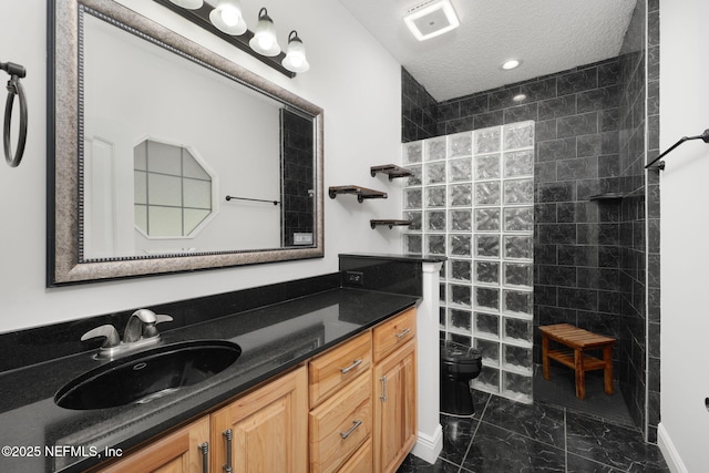 2871 Anchor Rd, Middleburg, FL 32068 - bathroom with marble finish flooring, vanity, a walk in shower, a textured ceiling, and recessed lighting