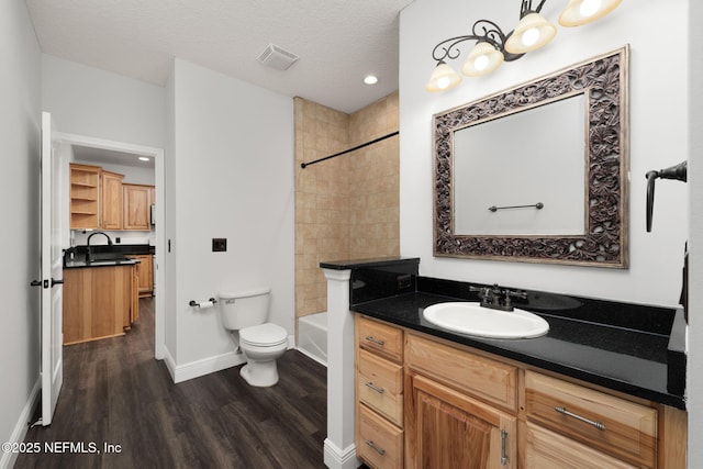 2871 Anchor Rd, Middleburg, FL 32068 - bathroom featuring vanity, wood finished floors, recessed lighting, shower / tub combination, and a textured ceiling