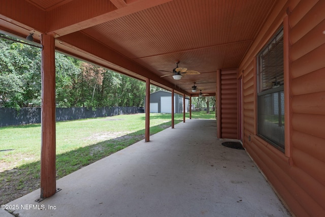 2871 Anchor Rd, Middleburg, FL 32068 - fenced backyard featuring ceiling fan, a patio, and a storage unit