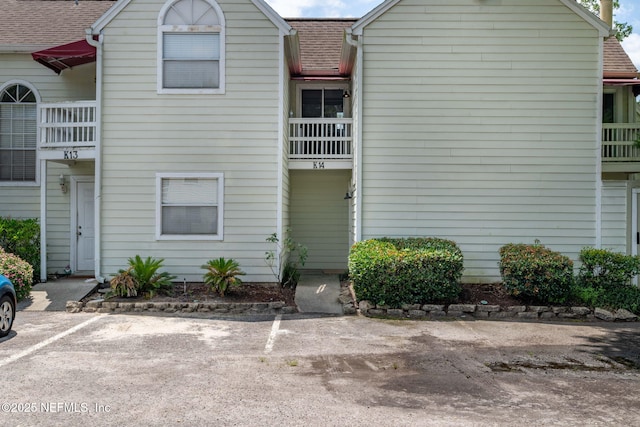 2300 Twelve Oaks Dr Unit K-14, Orange Park, FL 32065 - view of front of house featuring a shingled roof and uncovered parking