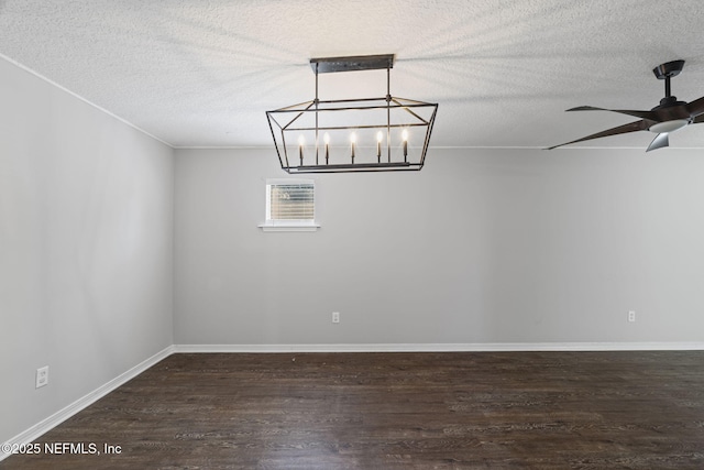 2300 Twelve Oaks Dr Unit K-14, Orange Park, FL 32065 - unfurnished room featuring dark wood-style flooring, a chandelier, a textured ceiling, and a ceiling fan