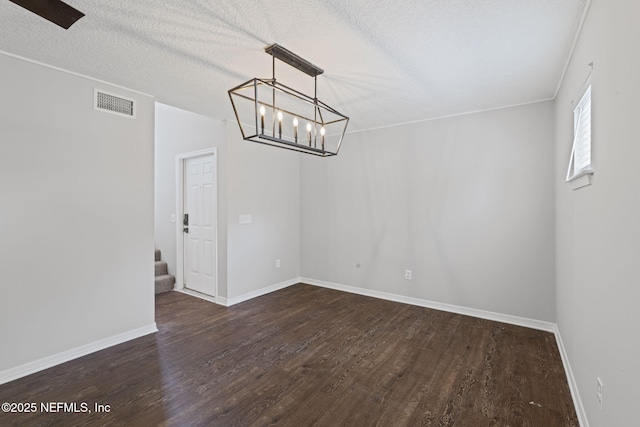 2300 Twelve Oaks Dr Unit K-14, Orange Park, FL 32065 - unfurnished dining area with dark wood-style floors, a chandelier, stairs, and a textured ceiling