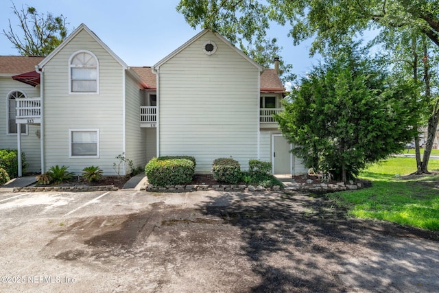 2300 Twelve Oaks Dr Unit K-14, Orange Park, FL 32065 - back of house featuring a chimney