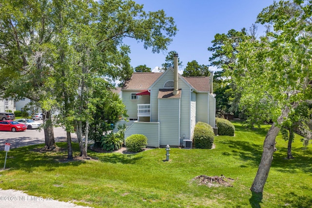 2300 Twelve Oaks Dr Unit K-14, Orange Park, FL 32065 - view of side of home with a lawn and a shingled roof