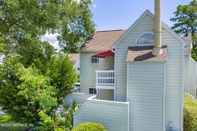 2300 Twelve Oaks Dr Unit K-14, Orange Park, FL 32065 - view of side of property featuring roof with shingles and a balcony