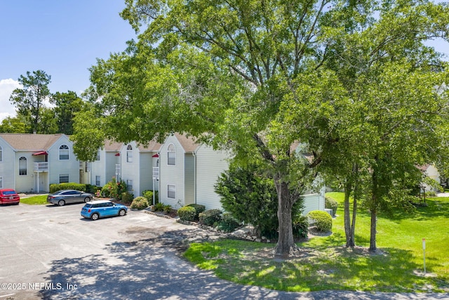 2300 Twelve Oaks Dr Unit K-14, Orange Park, FL 32065 - view of building exterior with uncovered parking