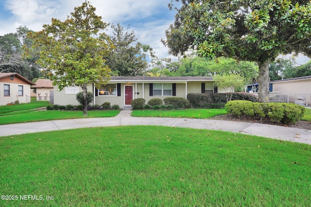 239 Glynlea Rd, Jacksonville, FL 32216 - ranch-style house with a front yard and brick siding