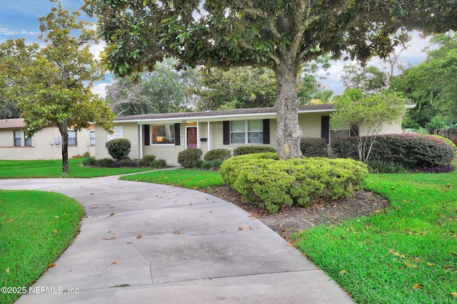 239 Glynlea Rd, Jacksonville, FL 32216 - ranch-style home with brick siding and a front yard