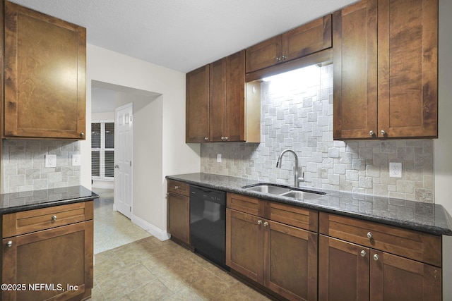 239 Glynlea Rd, Jacksonville, FL 32216 - kitchen featuring dishwasher, decorative backsplash, and dark stone countertops
