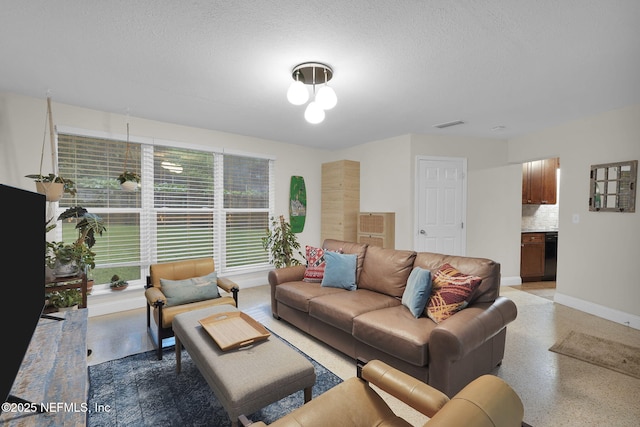 239 Glynlea Rd, Jacksonville, FL 32216 - living room with a textured ceiling and dark speckled floor