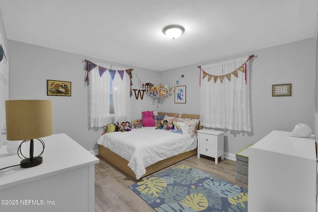 239 Glynlea Rd, Jacksonville, FL 32216 - bedroom featuring light wood-style floors and a textured ceiling
