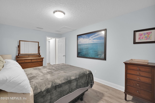 239 Glynlea Rd, Jacksonville, FL 32216 - bedroom featuring wood finished floors and a textured ceiling